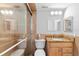 Bathroom features fully-tiled stand-up shower, wood vanity with granite countertops, and mirrored cabinet at 201 W Laurel St # 507, Tampa, FL 33602