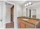 Bathroom featuring granite countertop vanity, recessed lights, and tiled stand-up shower at 201 W Laurel St # 507, Tampa, FL 33602