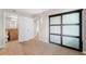 Bedroom featuring tile floors, an accent sliding closet door, and access to an ensuite bathroom at 201 W Laurel St # 507, Tampa, FL 33602