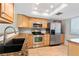 Kitchen featuring stainless steel appliances, granite countertops, and ample wood cabinetry at 201 W Laurel St # 507, Tampa, FL 33602