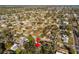 This aerial view highlights a property within a tree-lined neighborhood, indicated by a red arrow, offering a serene backdrop at 270 41St Ne Ave, St Petersburg, FL 33703