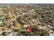 The bird's eye view showcases a peaceful neighborhood, with the property marked by a red arrow, offering an inviting setting at 270 41St Ne Ave, St Petersburg, FL 33703