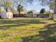 Expansive backyard with lush lawn, mature trees, and a shed on the property at 270 41St Ne Ave, St Petersburg, FL 33703