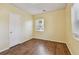 Sun-filled bedroom boasting neutral walls and wood-look flooring at 270 41St Ne Ave, St Petersburg, FL 33703