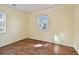 Bedroom featuring a large window and stylish flooring at 270 41St Ne Ave, St Petersburg, FL 33703