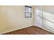 Bedroom featuring wood-look flooring, and a window with blinds at 270 41St Ne Ave, St Petersburg, FL 33703