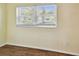 Bright room featuring wood-look tile flooring and large window at 270 41St Ne Ave, St Petersburg, FL 33703