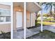 Covered porch with welcome mat leads to a well-maintained front door on a single-story home at 270 41St Ne Ave, St Petersburg, FL 33703