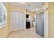 Kitchen featuring white cabinets, stainless steel refrigerator and tile flooring at 270 41St Ne Ave, St Petersburg, FL 33703