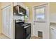 Well-lit kitchen with stainless steel microwave and range oven at 270 41St Ne Ave, St Petersburg, FL 33703