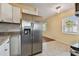 Bright kitchen with stainless steel refrigerator and light countertops at 270 41St Ne Ave, St Petersburg, FL 33703