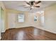 The living room features two windows and beautiful wood-look flooring at 270 41St Ne Ave, St Petersburg, FL 33703