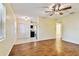 Open living area showcasing windows, closet, and tile flooring leading into the kitchen at 270 41St Ne Ave, St Petersburg, FL 33703