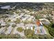 Aerial view of a community with well-maintained buildings and landscaping, along with a pool at 2725 Countryside Blvd # 103, Clearwater, FL 33761