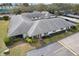 Aerial view of property showing roof, landscaping, and driveway with convenient parking at 2725 Countryside Blvd # 103, Clearwater, FL 33761