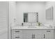 Bathroom vanity features shaker cabinets, quartz countertop, modern faucet, and framed mirror at 2725 Countryside Blvd # 103, Clearwater, FL 33761