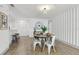 Charming dining room featuring modern lighting, round table, and stylish decor at 2725 Countryside Blvd # 103, Clearwater, FL 33761