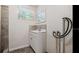 Bathroom with tiled vanity, mirror and window for natural light at 3017 Sanchez St # 1/2, Tampa, FL 33605