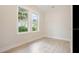 Bedroom featuring hardwood floors and natural light from two large windows at 3017 Sanchez St # 1/2, Tampa, FL 33605