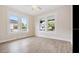 Bedroom featuring hardwood floors, natural light from large windows, and neutral colored walls at 3017 Sanchez St # 1/2, Tampa, FL 33605