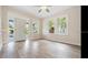 Living room featuring hardwood floors, natural light from large windows and front door entrance at 3017 Sanchez St # 1/2, Tampa, FL 33605