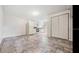 Living room featuring tile floors, an open concept to the kitchen, closet and white walls at 3017 Sanchez St # 1/2, Tampa, FL 33605