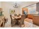 Cozy dining area adjacent to the kitchen with a modern chandelier and comfortable seating at 308 Los Prados Dr # 308, Safety Harbor, FL 34695