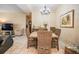 Cozy dining room with a wooden table, wicker chairs, and neutral paint at 308 Los Prados Dr # 308, Safety Harbor, FL 34695