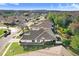 An aerial view showcases a light colored home with a lush green yard at 31031 Whitlock Dr, Wesley Chapel, FL 33543