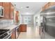 Well-equipped kitchen featuring granite countertops, stainless steel appliances, and tiled flooring at 31031 Whitlock Dr, Wesley Chapel, FL 33543