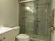 Modern bathroom showcasing a glass-enclosed shower with decorative tile and updated fixtures at 3161 Lake Pine S Way # F1, Tarpon Springs, FL 34688