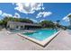 Community pool with a spa and lots of lounge seating and room for relaxing at 3161 Lake Pine S Way # F1, Tarpon Springs, FL 34688