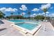 Outdoor community pool with a hot tub and inviting clear blue water at 3161 Lake Pine S Way # F1, Tarpon Springs, FL 34688