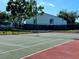 Well-maintained tennis court in a lovely green setting at 3161 Lake Pine S Way # F1, Tarpon Springs, FL 34688