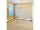 Spacious living room with carpet flooring and natural light from a large window at 3320 Broken Bow Dr, Land O Lakes, FL 34639