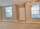 Living room area featuring neutral walls and a view of the entryway at 3320 Broken Bow Dr, Land O Lakes, FL 34639