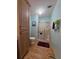 Bright bathroom features a toilet, walk-in shower and ample storage at 36830 Kimela Ave, Zephyrhills, FL 33542