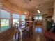 Warm dining area with a wood table, chandelier lighting, and a view into the adjacent kitchen space at 36830 Kimela Ave, Zephyrhills, FL 33542