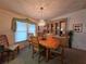 Cozy dining room featuring a classic wooden table set and built-in storage for an elegant feel at 36830 Kimela Ave, Zephyrhills, FL 33542