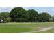 Scenic view of a well-maintained golf course with an American flag waving at 36830 Kimela Ave, Zephyrhills, FL 33542