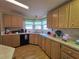 Well-lit kitchen featuring abundant cabinetry and a functional layout, perfect for cooking and entertaining at 36830 Kimela Ave, Zephyrhills, FL 33542