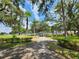 A peaceful community park featuring a walking path and well-maintained landscaping at 36830 Kimela Ave, Zephyrhills, FL 33542