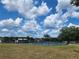 Outdoor pickleball courts featuring blue playing surfaces, black fencing, and a grassy surrounding area at 36830 Kimela Ave, Zephyrhills, FL 33542