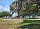 Outdoor shuffleboard courts offer recreation and leisure for residents of all ages, near covered pavilion and majestic moss-draped trees at 36830 Kimela Ave, Zephyrhills, FL 33542