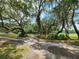 The park features mature trees along a paved path for walking, biking or strolling at 36830 Kimela Ave, Zephyrhills, FL 33542