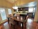 Dining area with wood floors and a view into the remodeled kitchen at 3917 103Rd N Ave, Clearwater, FL 33762