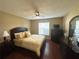 Cozy main bedroom with warm lighting and neutral décor at 3917 103Rd N Ave, Clearwater, FL 33762