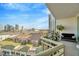 Enjoy city views from this balcony, complete with seating and lush greenery at 450 Knights Run Ave # 1005, Tampa, FL 33602