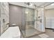 Contemporary bathroom featuring marble accents, sleek glass shower, and modern fixtures at 450 Knights Run Ave # 1005, Tampa, FL 33602