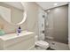 Modern bathroom with a stand-up shower and a floating sink and toilet at 450 Knights Run Ave # 1005, Tampa, FL 33602